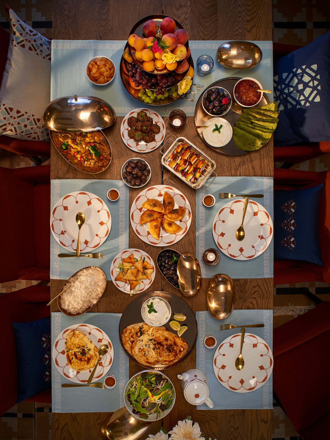 A table set with a feast using the entire GOKVÄLLÅ range of home accessories.