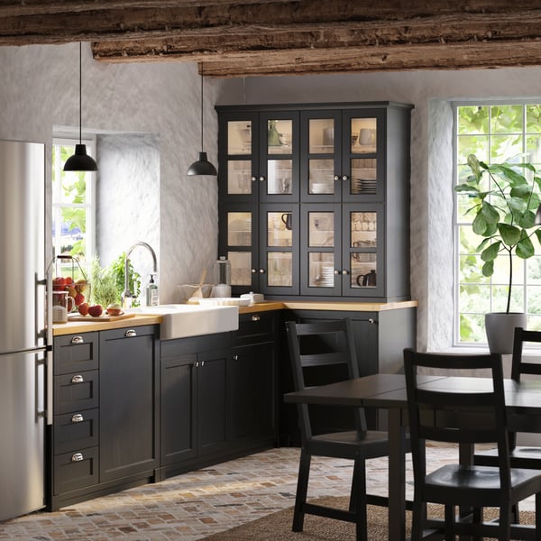 A black NORDVIKEN extendable table in the kitchen