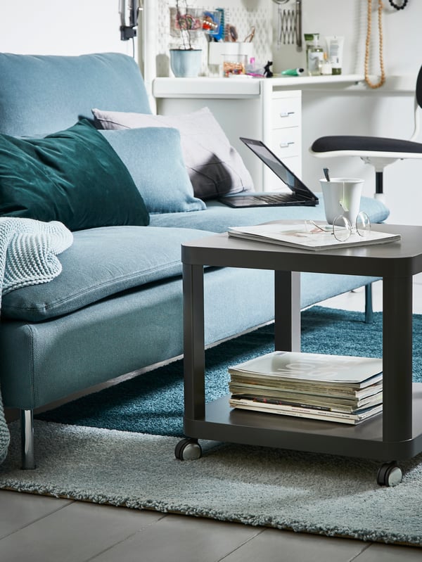 A grey TINGBY side table on castors in the living room