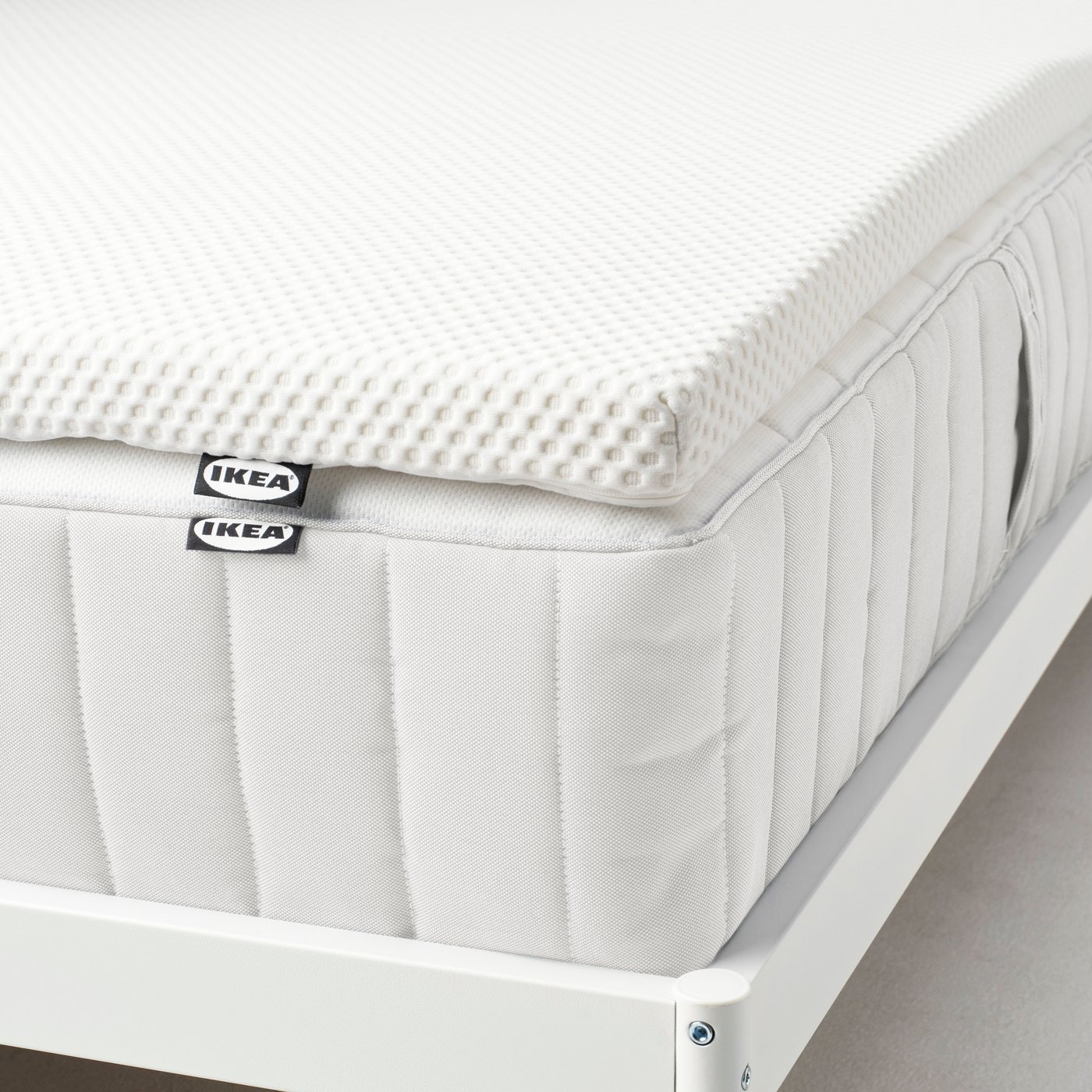 A white NORDBERGET mattress pad