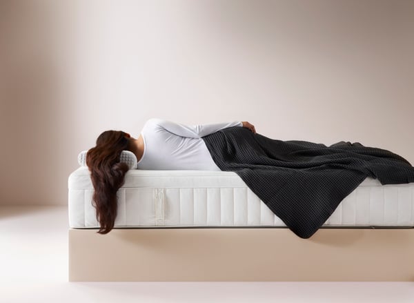 A medium firm/white HESSTUN eurotop mattress in the bedroom