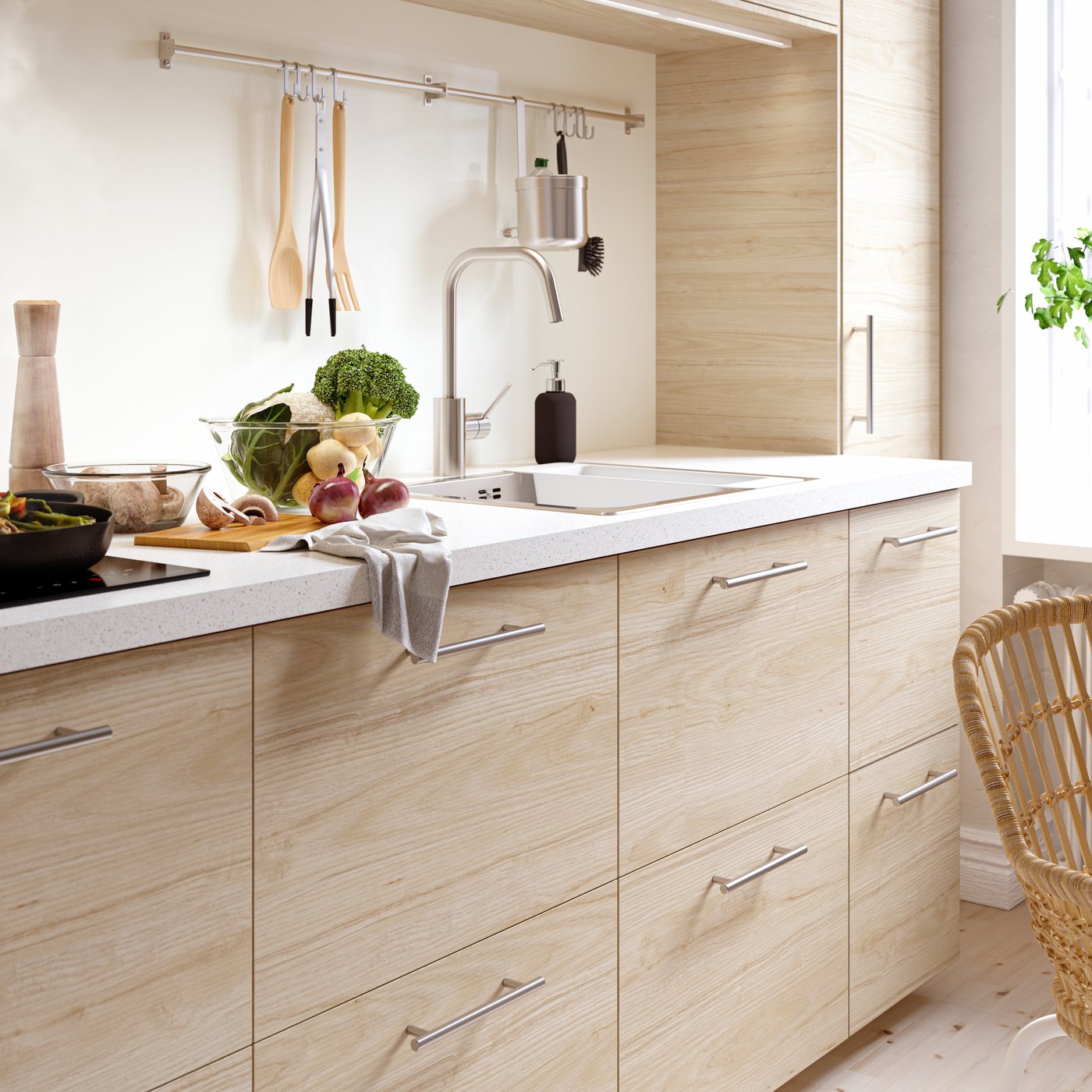 A stainless steel colour ÄLMAREN kitchen mixer tap in the kitchen