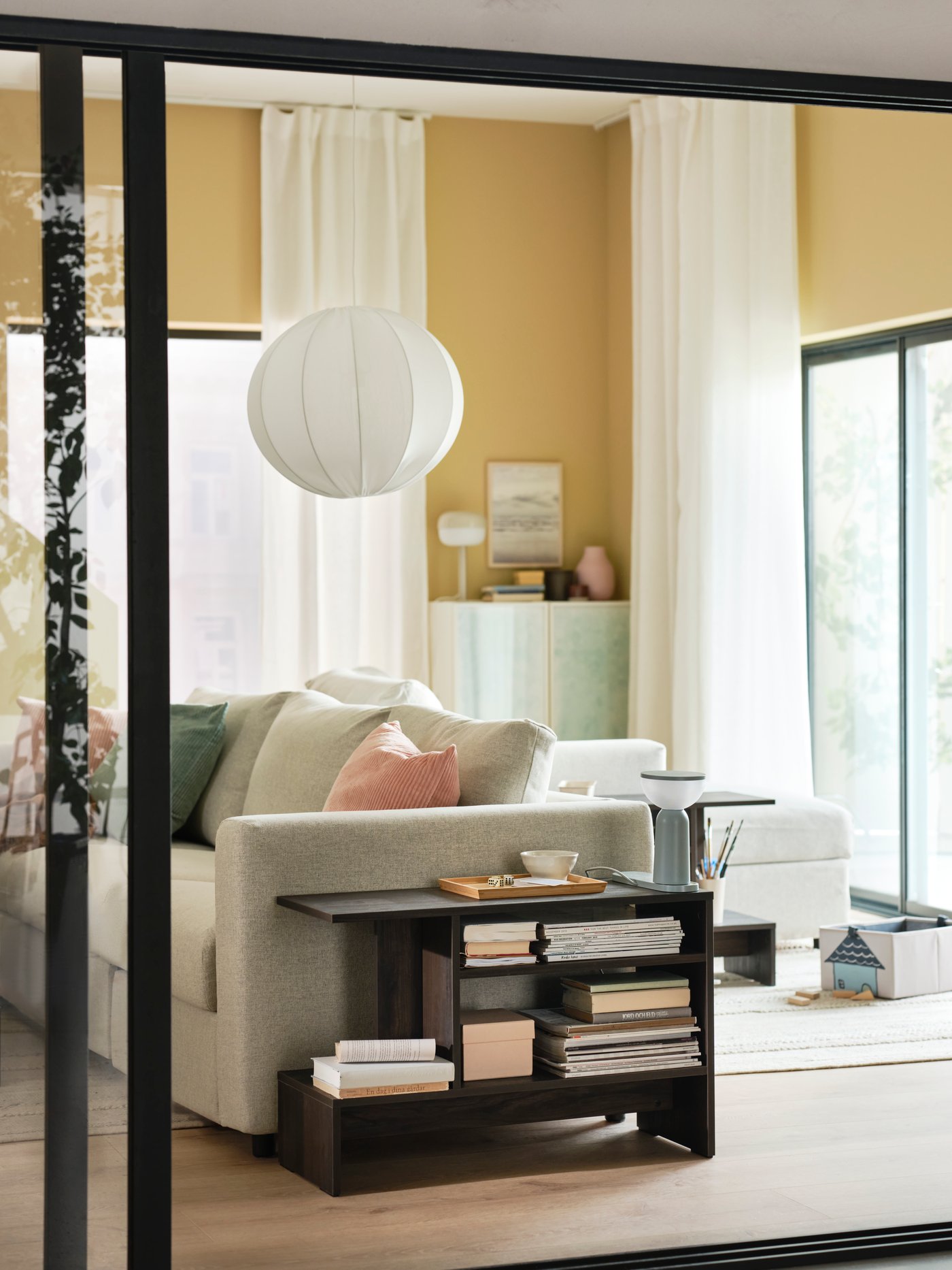 A dark brown HOLMERUD side table