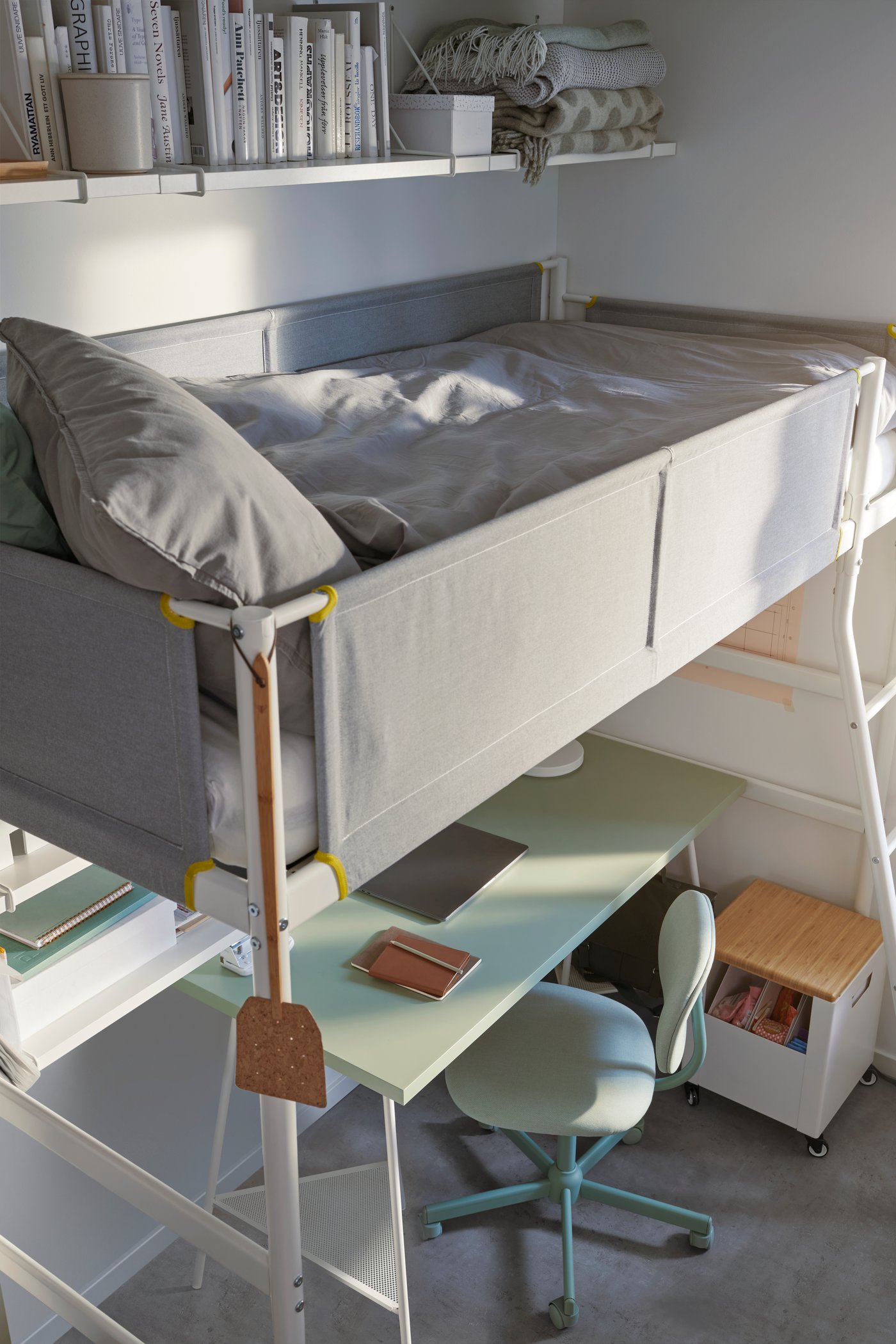 A VITVAL loft bed frame on top of Idekulla light green BLECKBERGET swivel chair in children's room