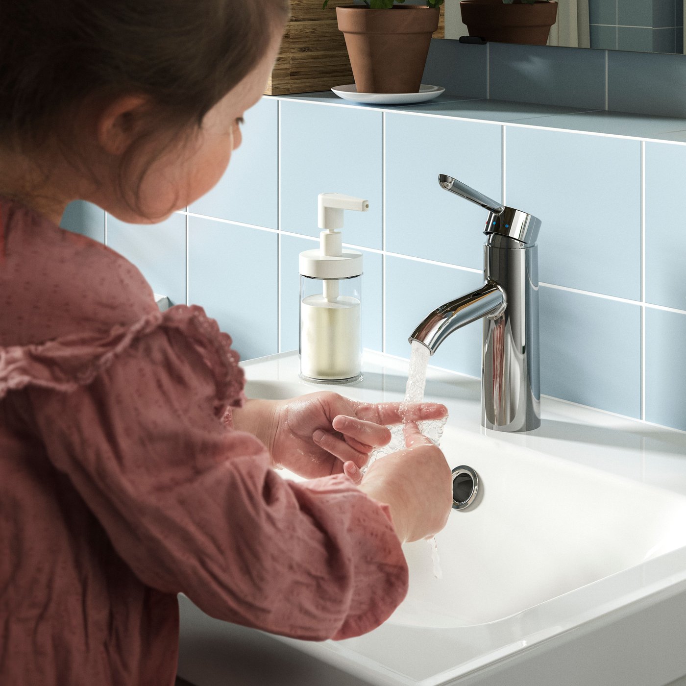 A chrome-plated DALSKÄR wash-basin mixer tap in the bathroom
