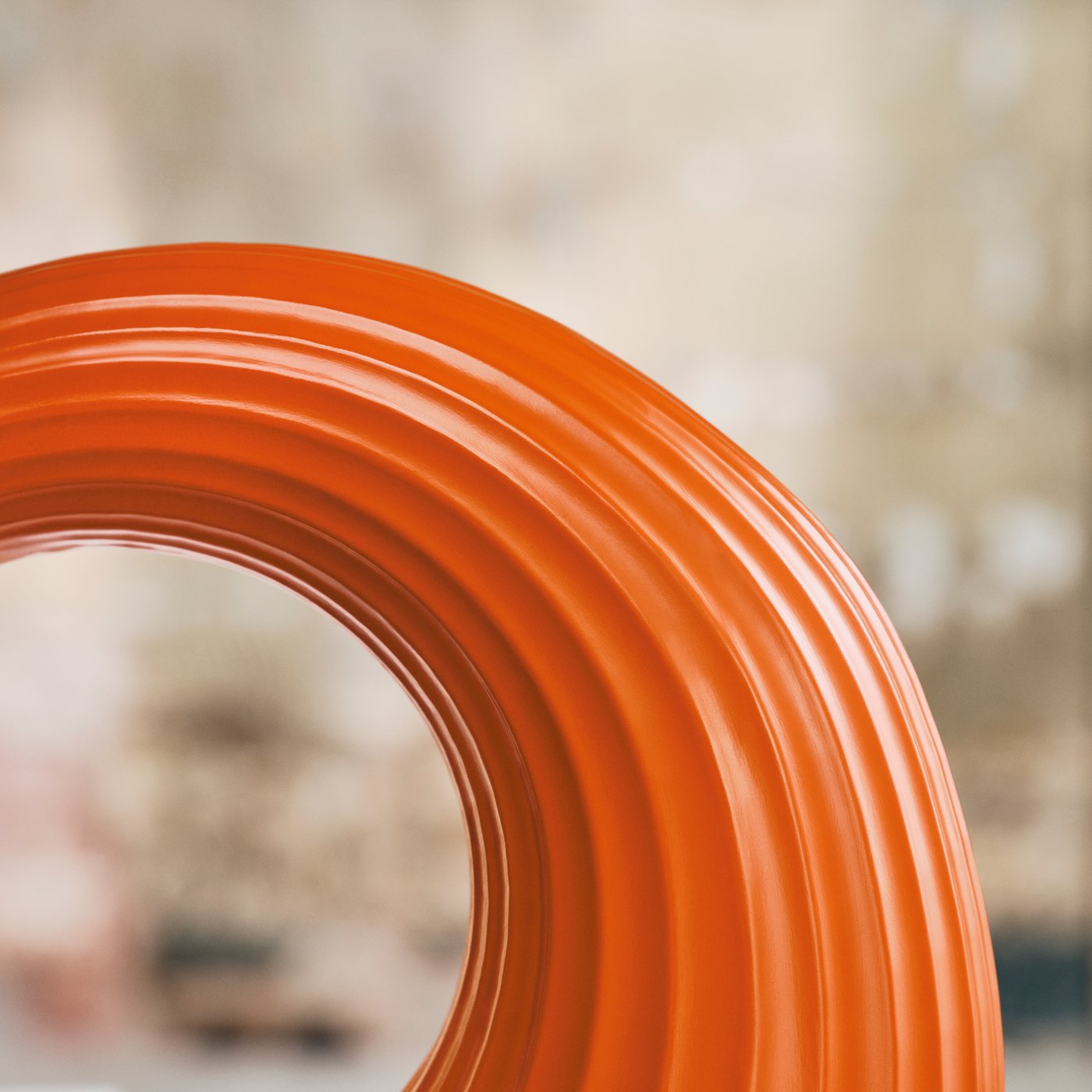 Close up of a arch-like detail of an orange sculpture that is part of IKEA KONSTRUNDA art collection.