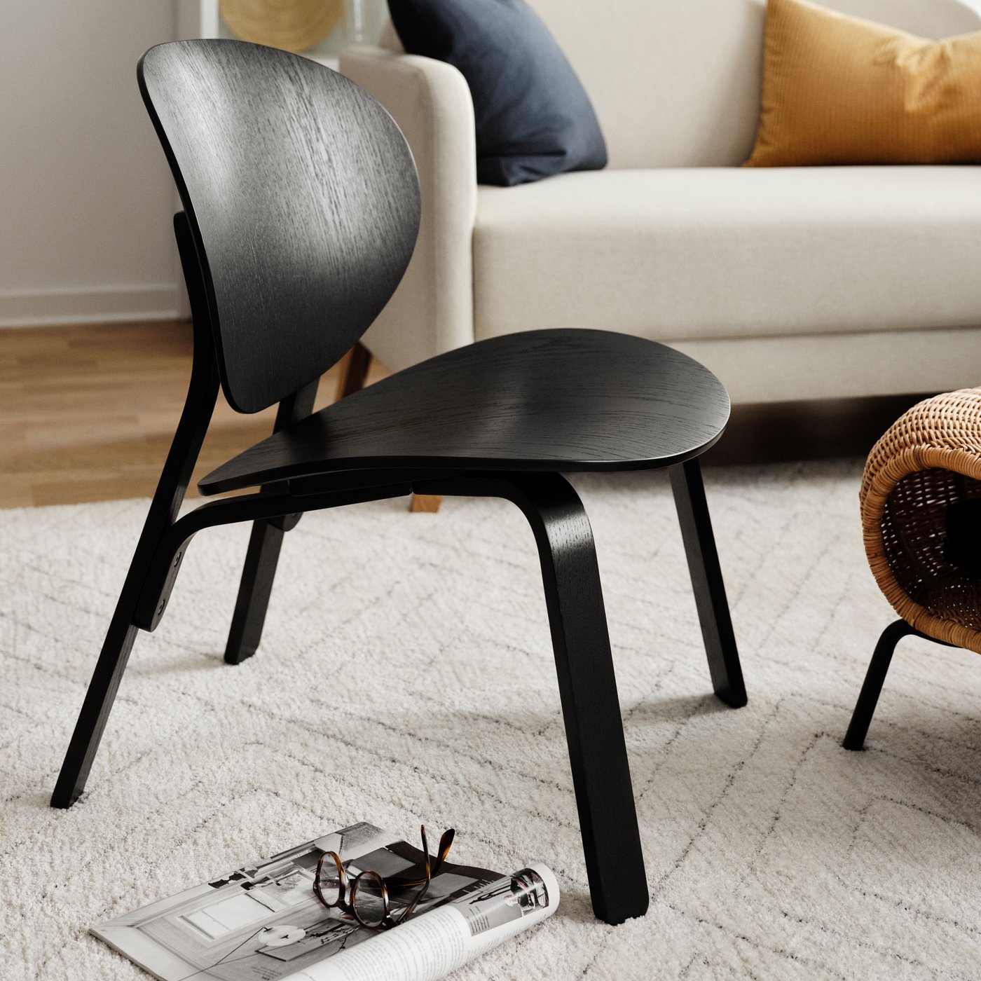 A black stained oak veneer FRÖSET easy chair