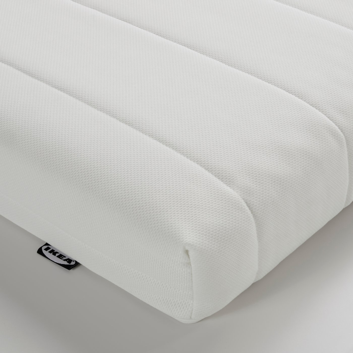A medium firm/white ÅFJÄLL foam mattress