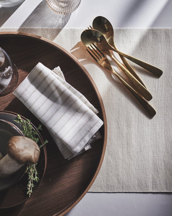 A striped light beige/off-white SILVERARV napkin