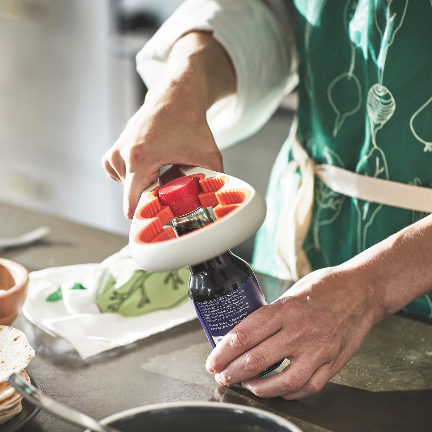 An off-white/bright orange UPPFYLLD jar opener