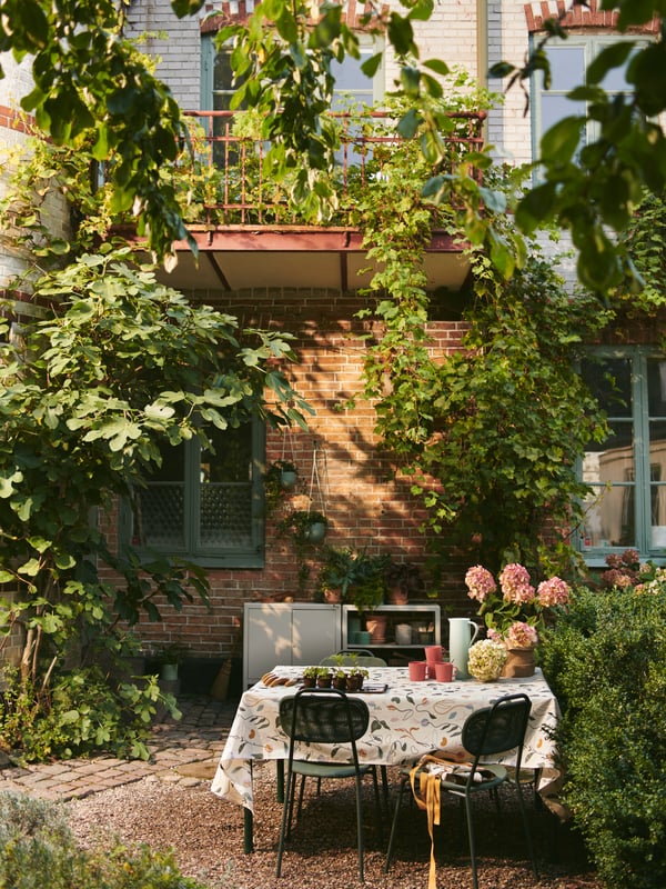A green outdoor ENSHOLM chair