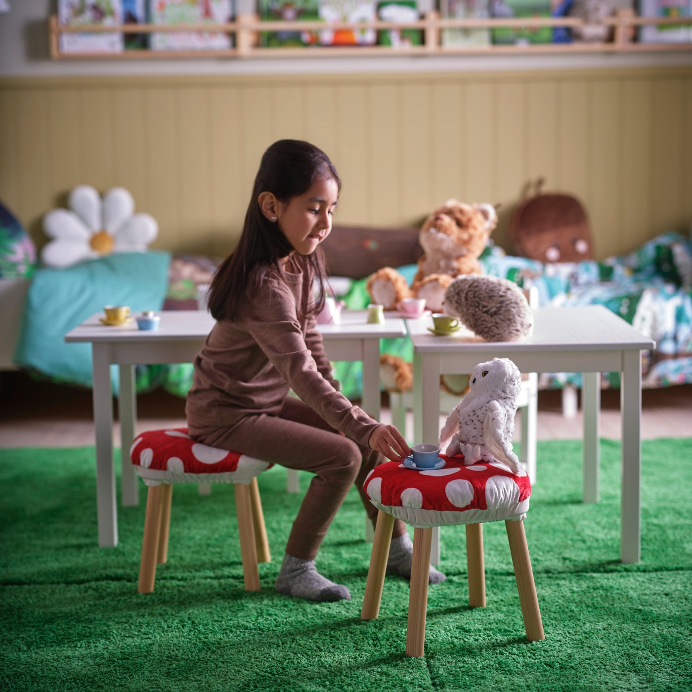 A mixed colours DUKTIG 8-piece cup/saucer playset in the childrens room