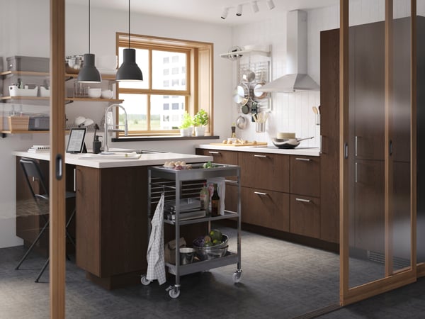 A stainless steel KALLRÖR handle in the kitchen