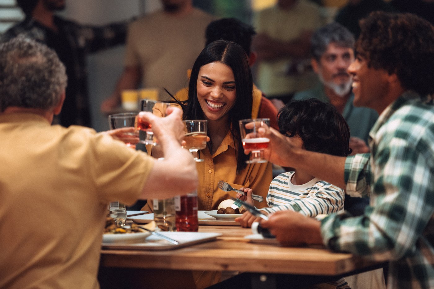 A family sitting in an IKEA Swedish Restaurant, enjoying a meal.