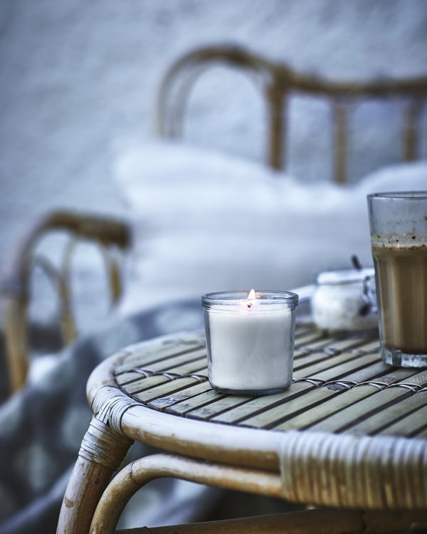 A Vanilla/light beige JÄMLIK scented candle in glass