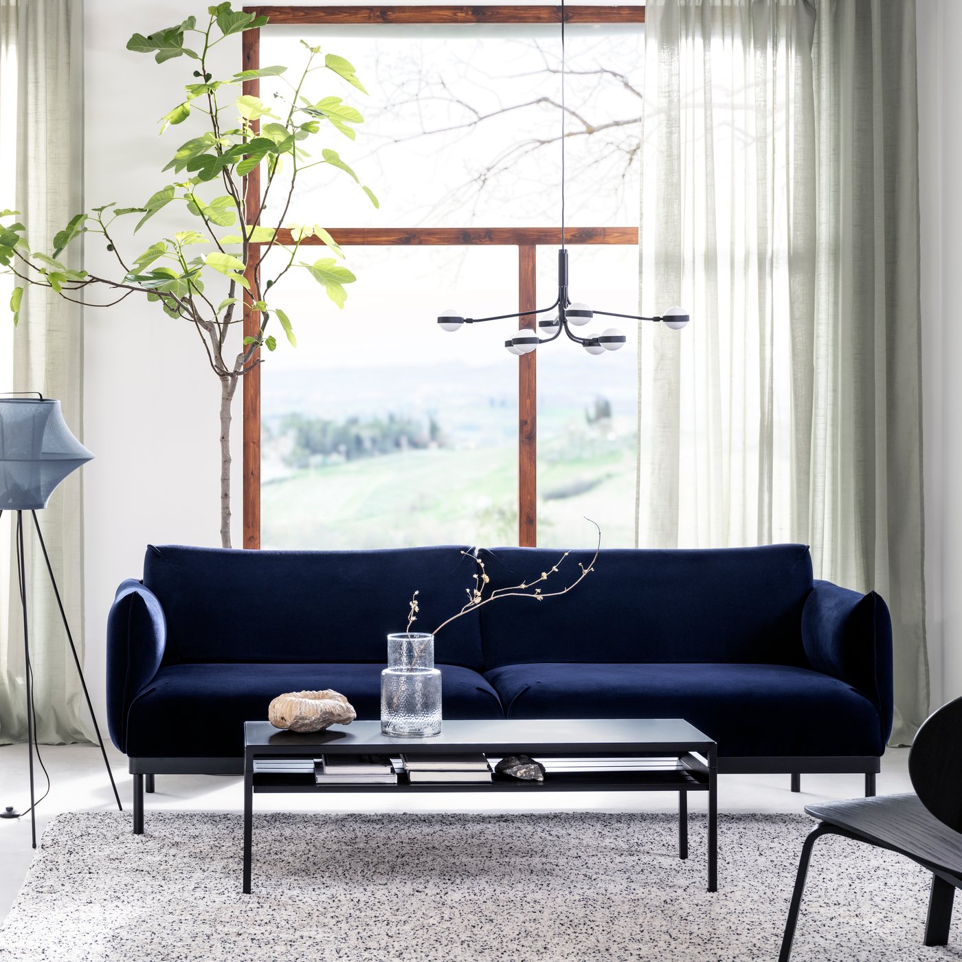 A Djuparp dark blue ÄPPLARYD 3-seat sofa in the living room