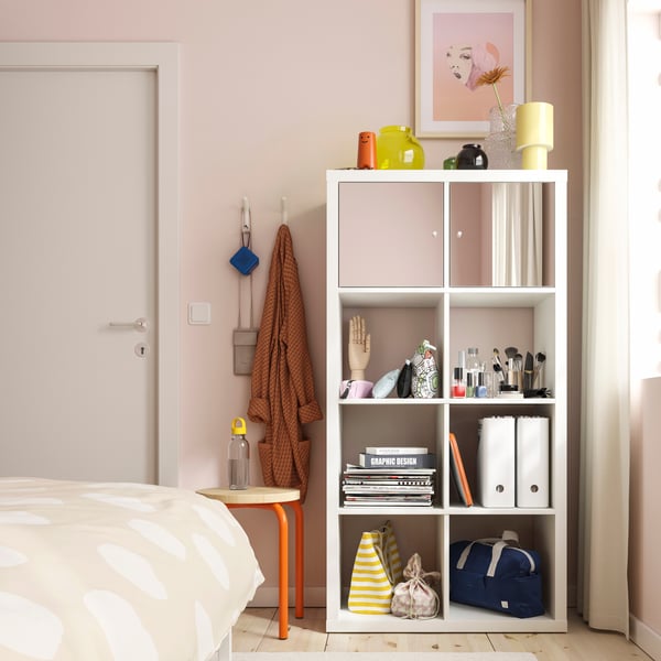 A KALLAX insert with mirror door