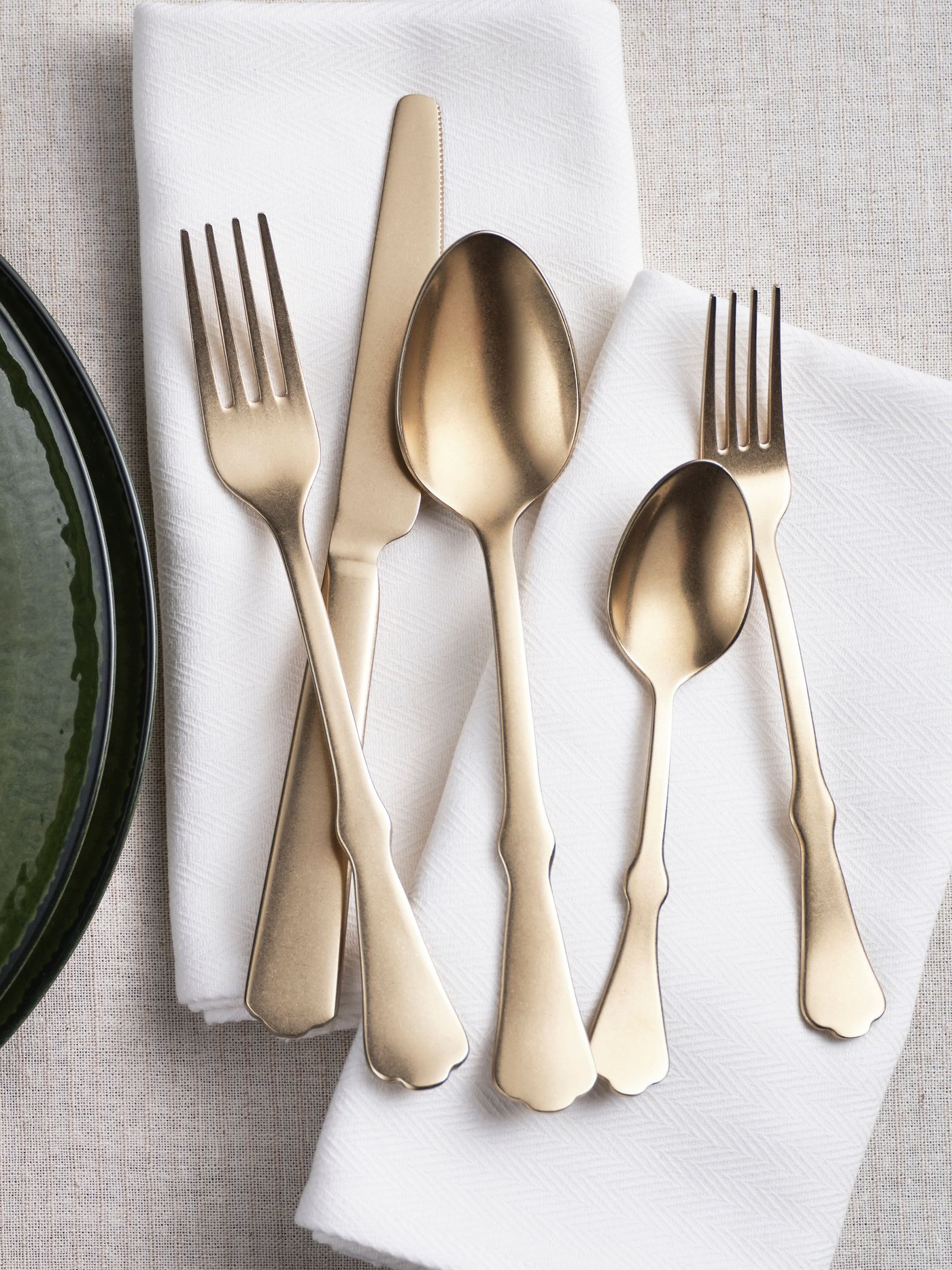 A gold-colour NATTKLOT 24-piece cutlery set