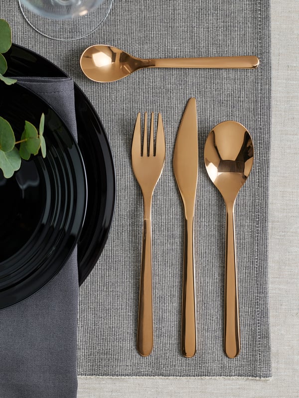 A rose-gold colour FÖRNUFT 24-piece cutlery set