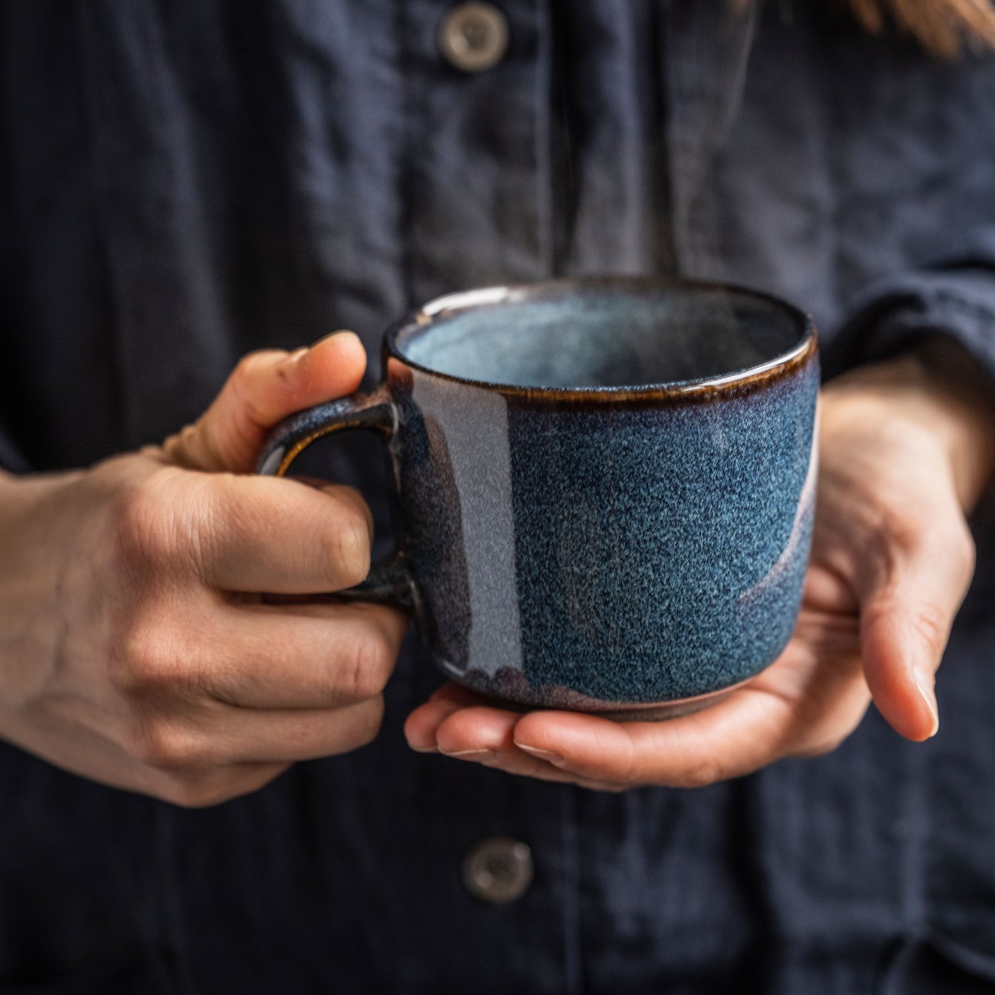 A blue GLADELIG mug