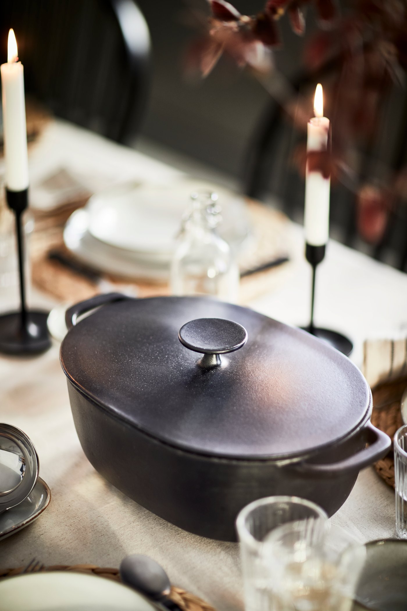 An enamelled cast iron matt/black VARDAGEN casserole with lid in the dining room