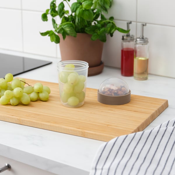 A transparent/light grey-brown SPLITTERNY snack container
