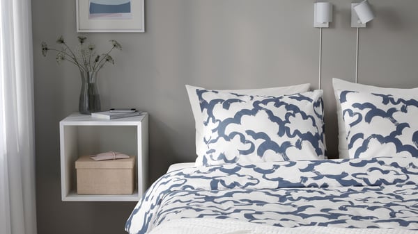 A white blue/cloud EKPURPURMAL duvet cover and pillowcase