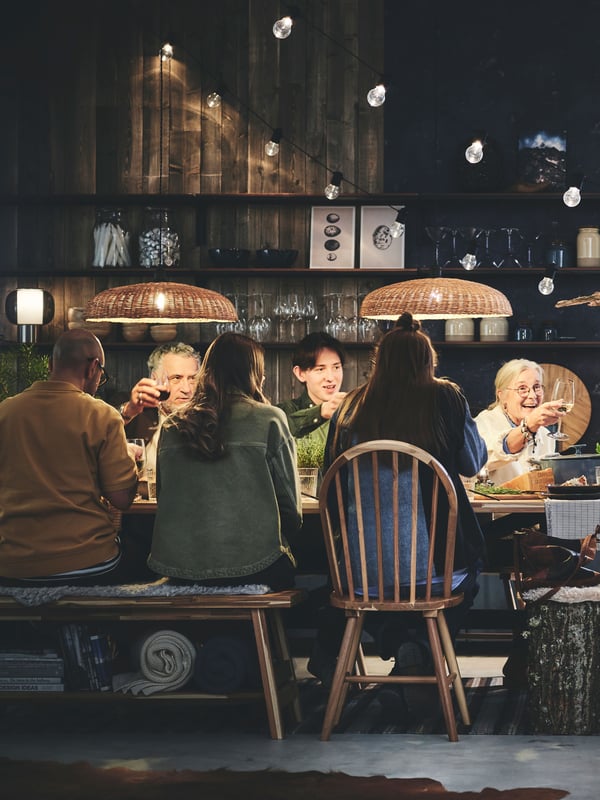 An acacia SKOGSTA chair in the dining room