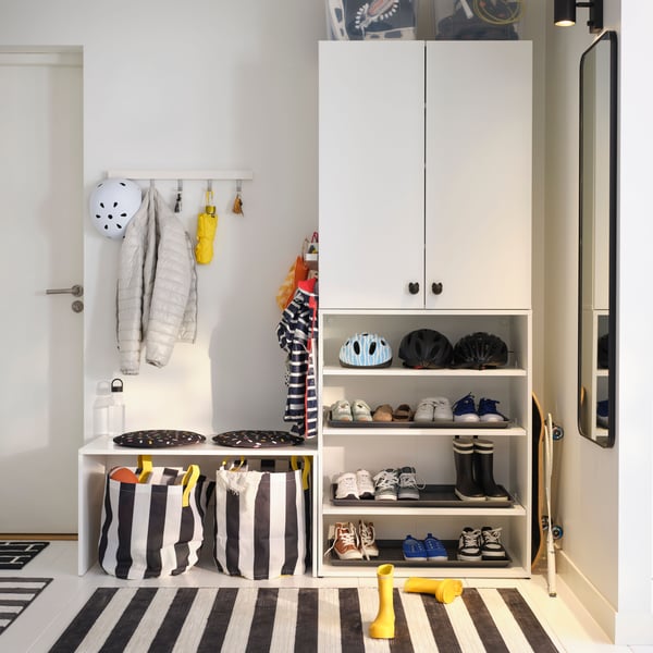 A white TJUSIG hanger for door/wall in the hallway