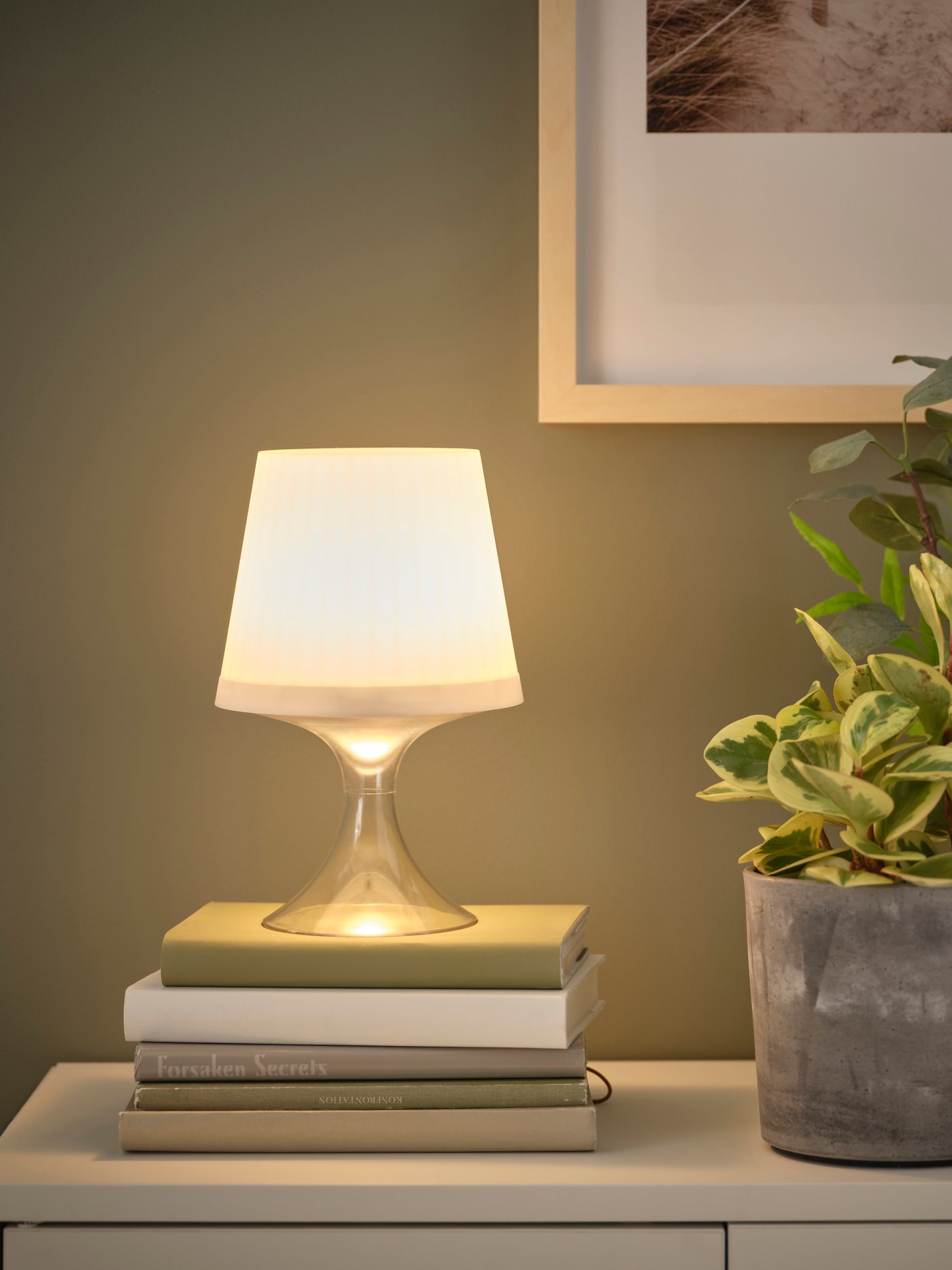 A battery-operated adjustable colour/outdoor white LAMPAN LED portable lamp