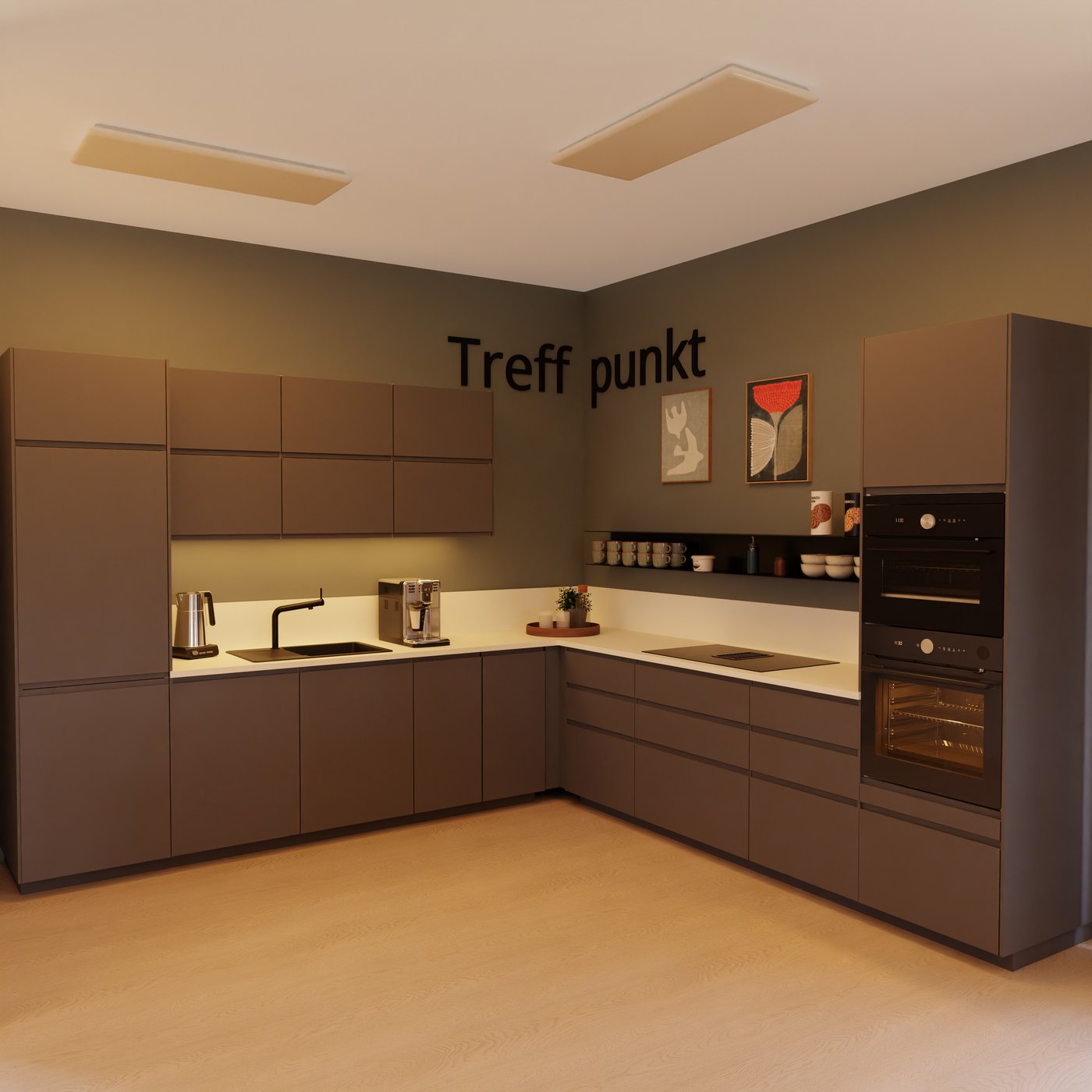 Moderne Küche mit grauen Schränken, weißer Arbeitsplatte, Spüle, Kaffeemaschine und Öfen. "Treffpunkt" an der Wand, Holzboden