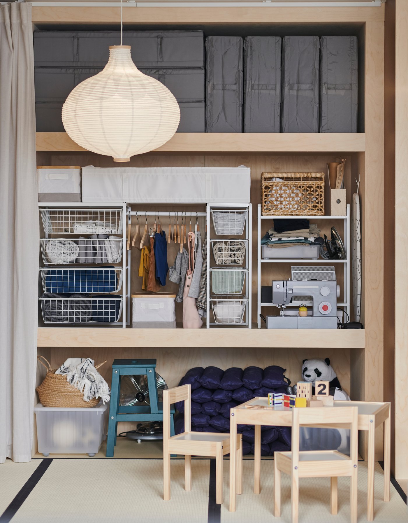 A dark grey SKUBB storage case in the childrens room