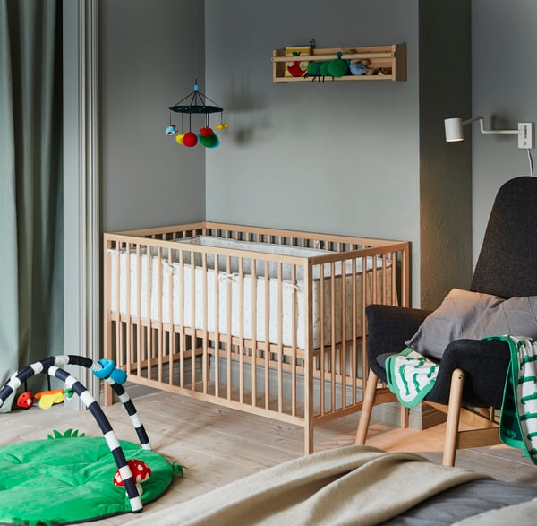 A light white stained pine FLISAT wall storage in the childrens room