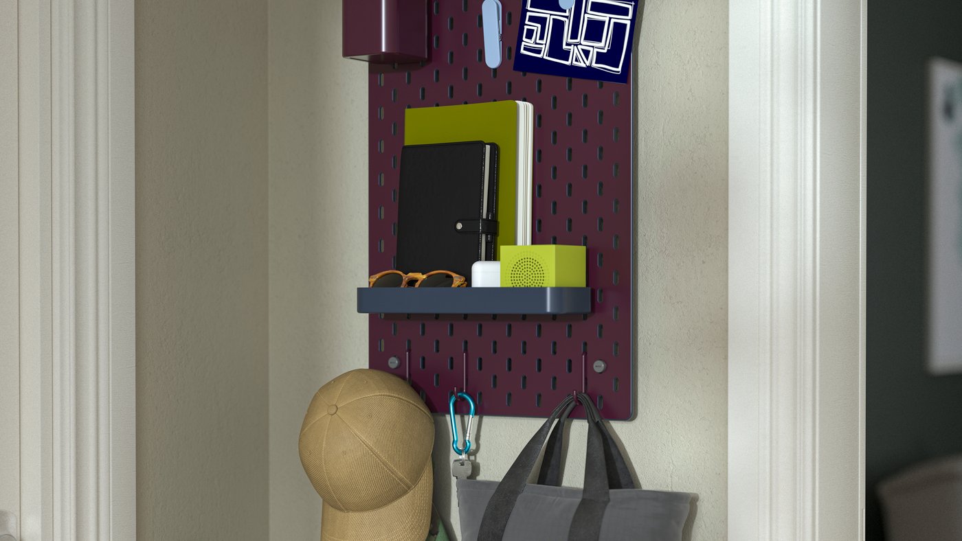 A double sided/multicolour SKÅDIS pegboard combination in the hallway
