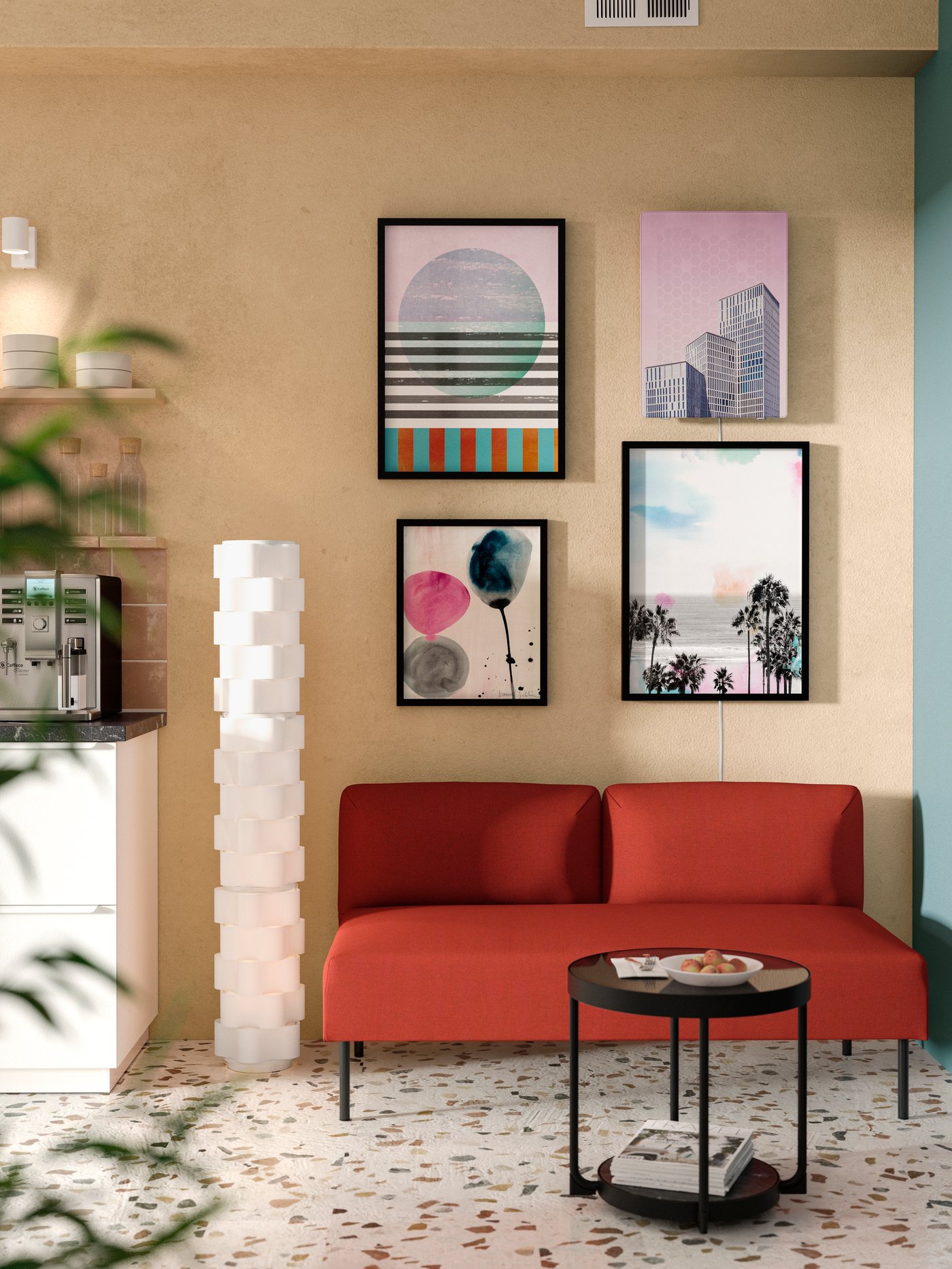 A red, two-seat LILLEHEM modular sofa without armrests is by a blush-coloured wall with modern framed prints and a speaker.