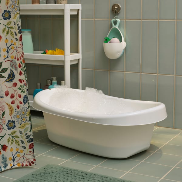 A white/turquoise LÄTTSAM baby bath