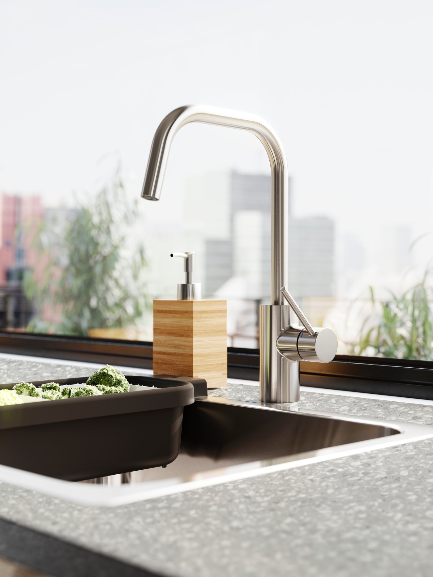 A stainless steel colour ÄLMAREN kitchen mixer tap in the kitchen