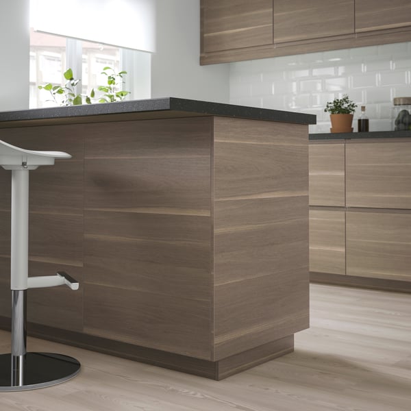 A walnut effect VOXTORP cover panel