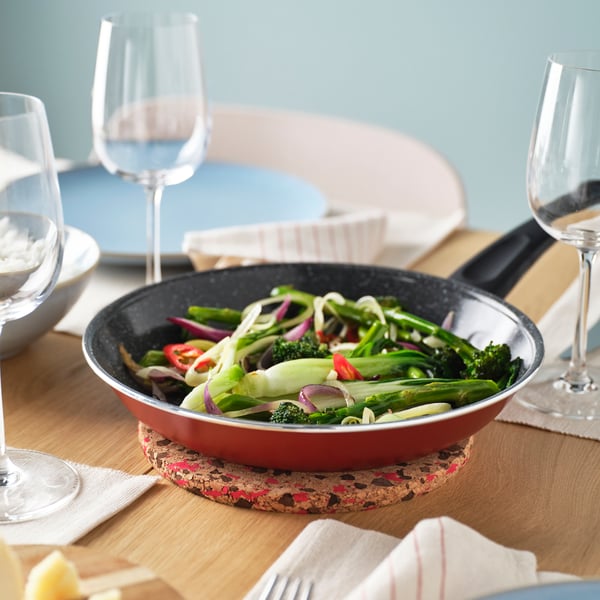 A non-stick coating red HEMLAGAD frying pan