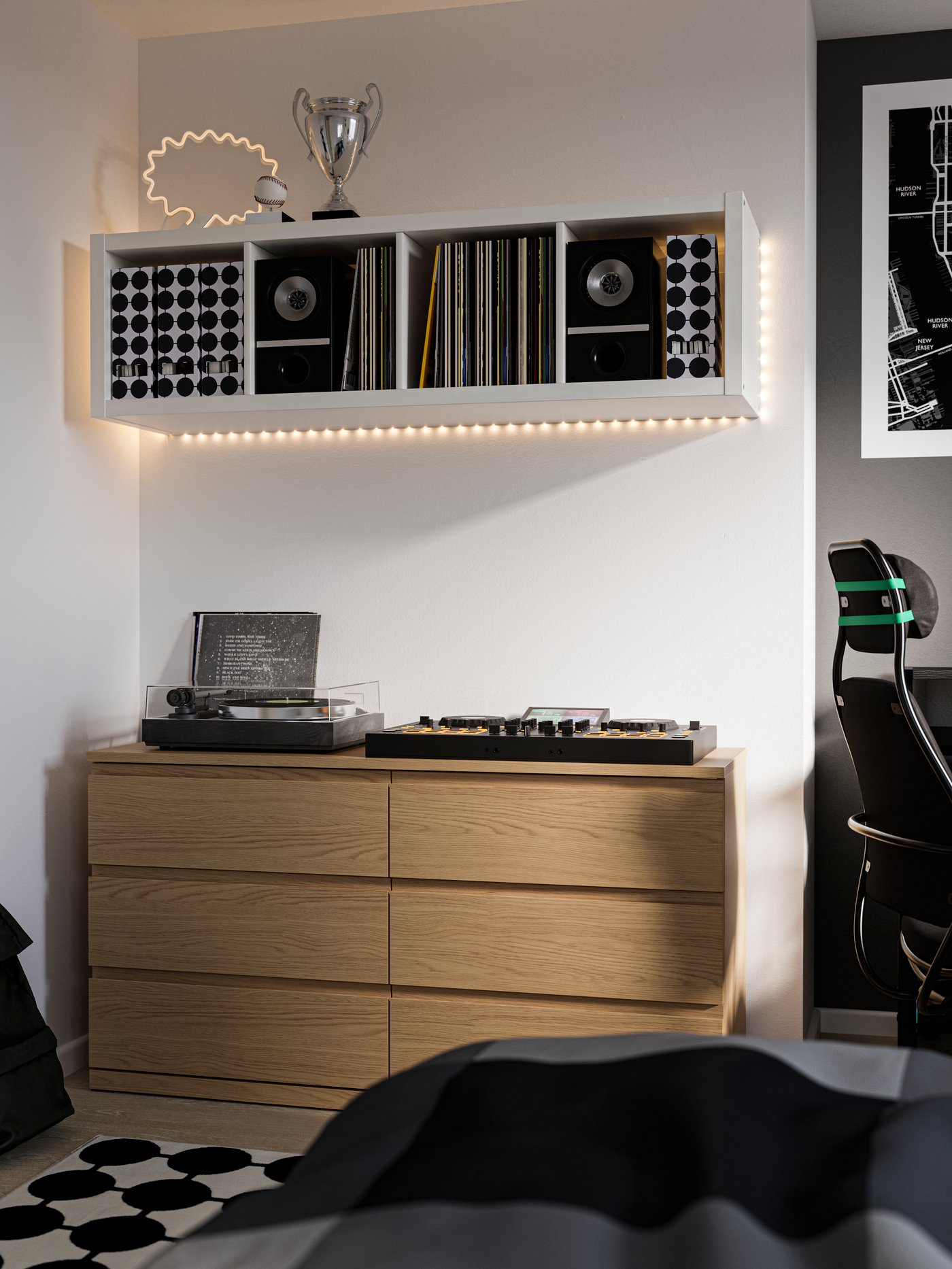 MALM chest of drawers in light oak with record players on top of it. White KALLAX shelving unit on the wall above.