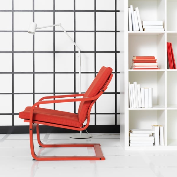 A red stained POÄNG armchair frame with low back