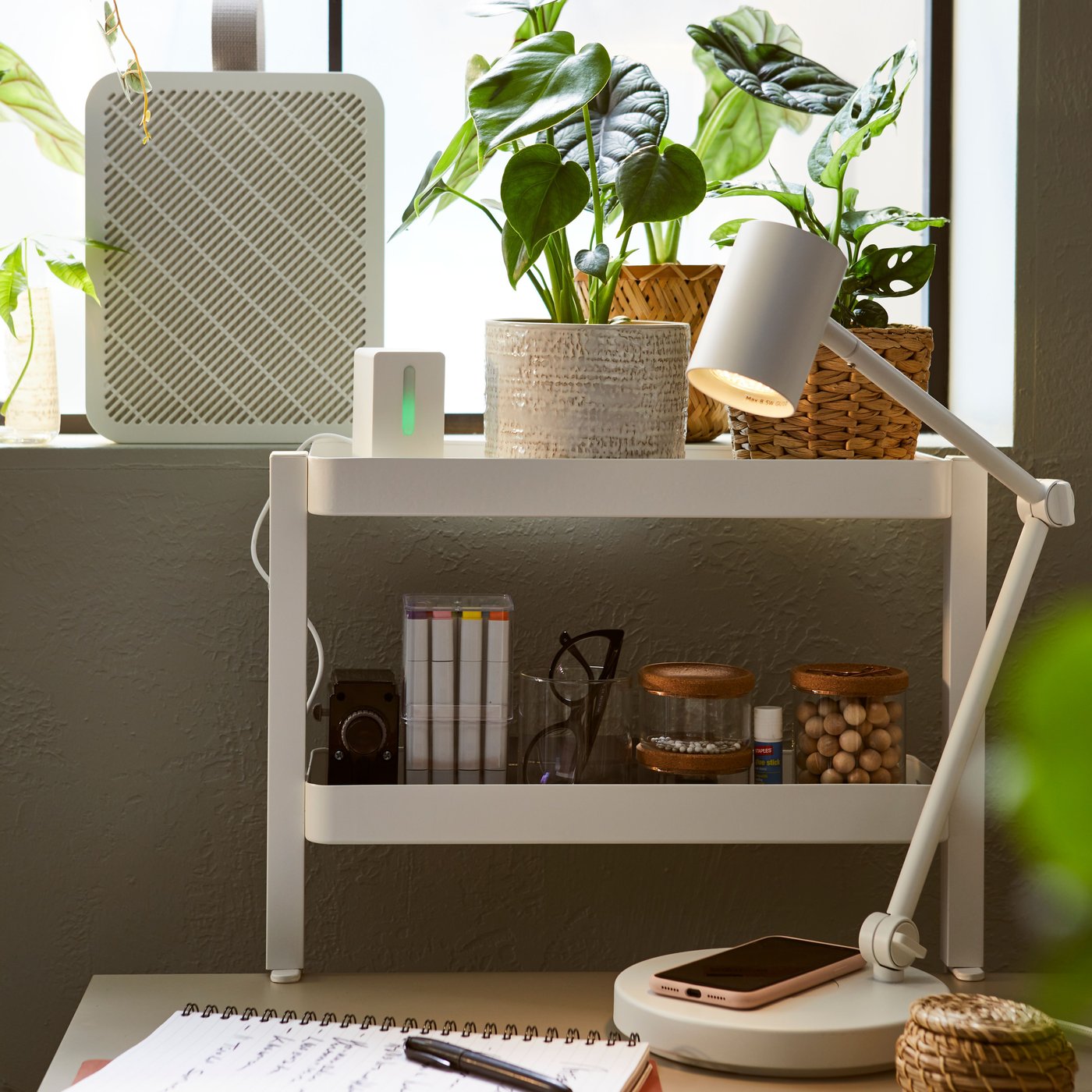 An UPPÅTVIND air purifier and white VATTENKAR shelf and white NYMANE desk lamp in children study room