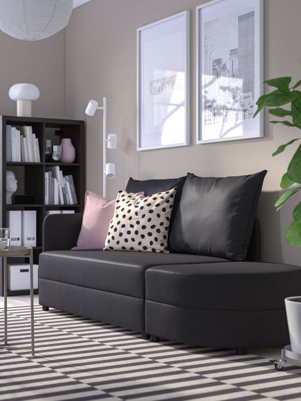 A Vissle dark grey LINDÅKRA 2-seat sofa-bed