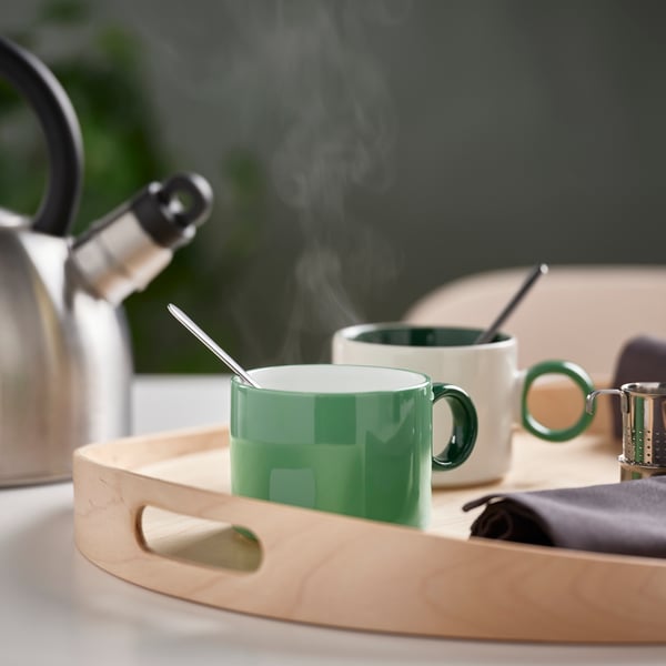 A white/green PIGGÅL mug