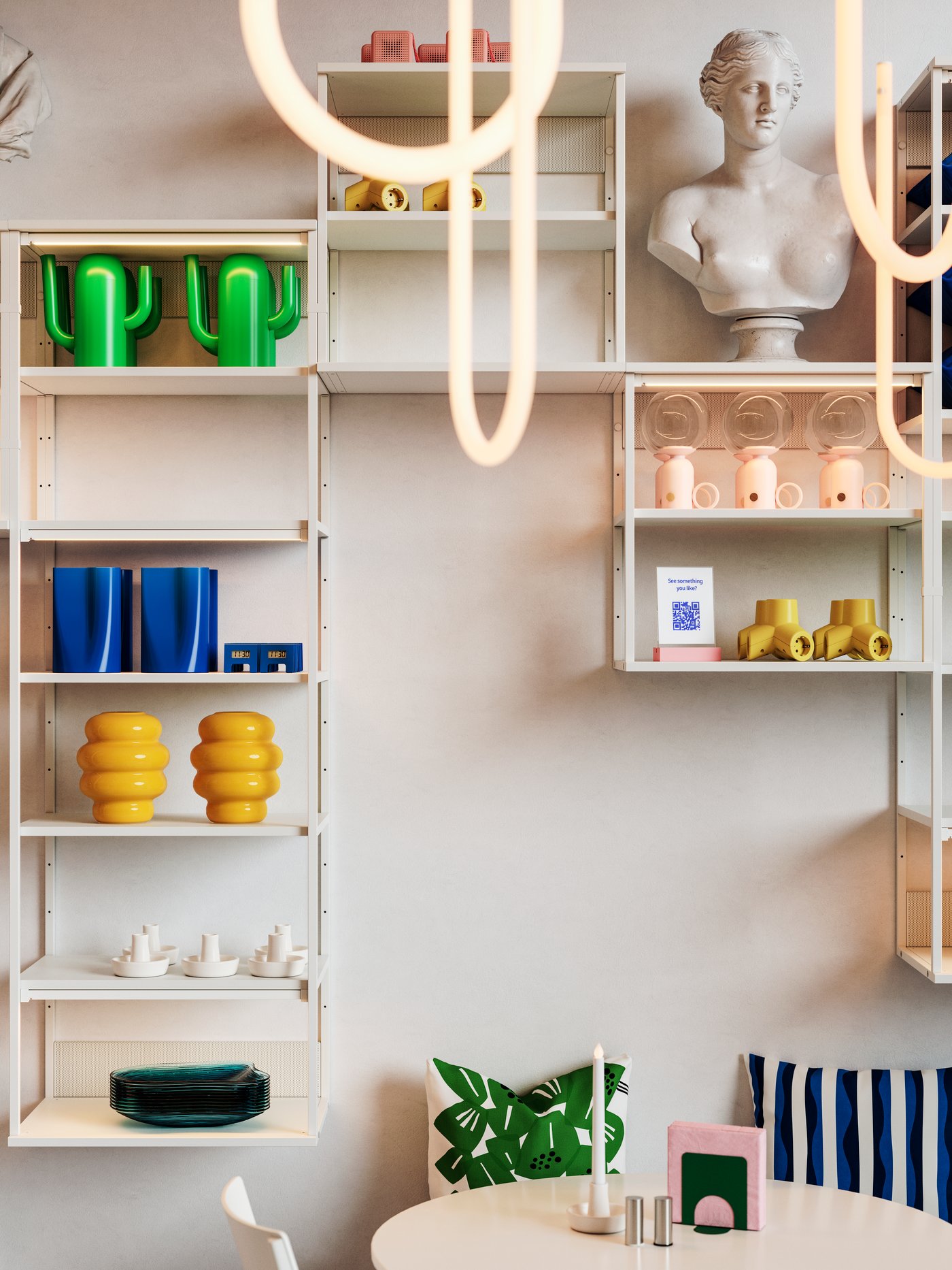 A café with VARMBLIXT LED pendant lamps in white frosted glass and open shelving units displaying bright home deco objects.