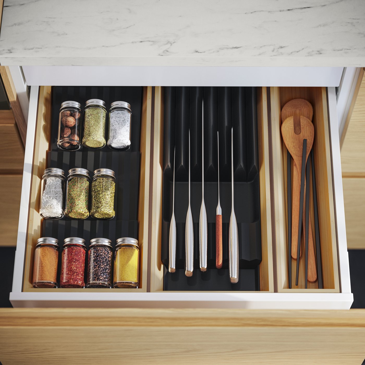A clear glass/stainless steel GULDFISK spice jar in the kitchen