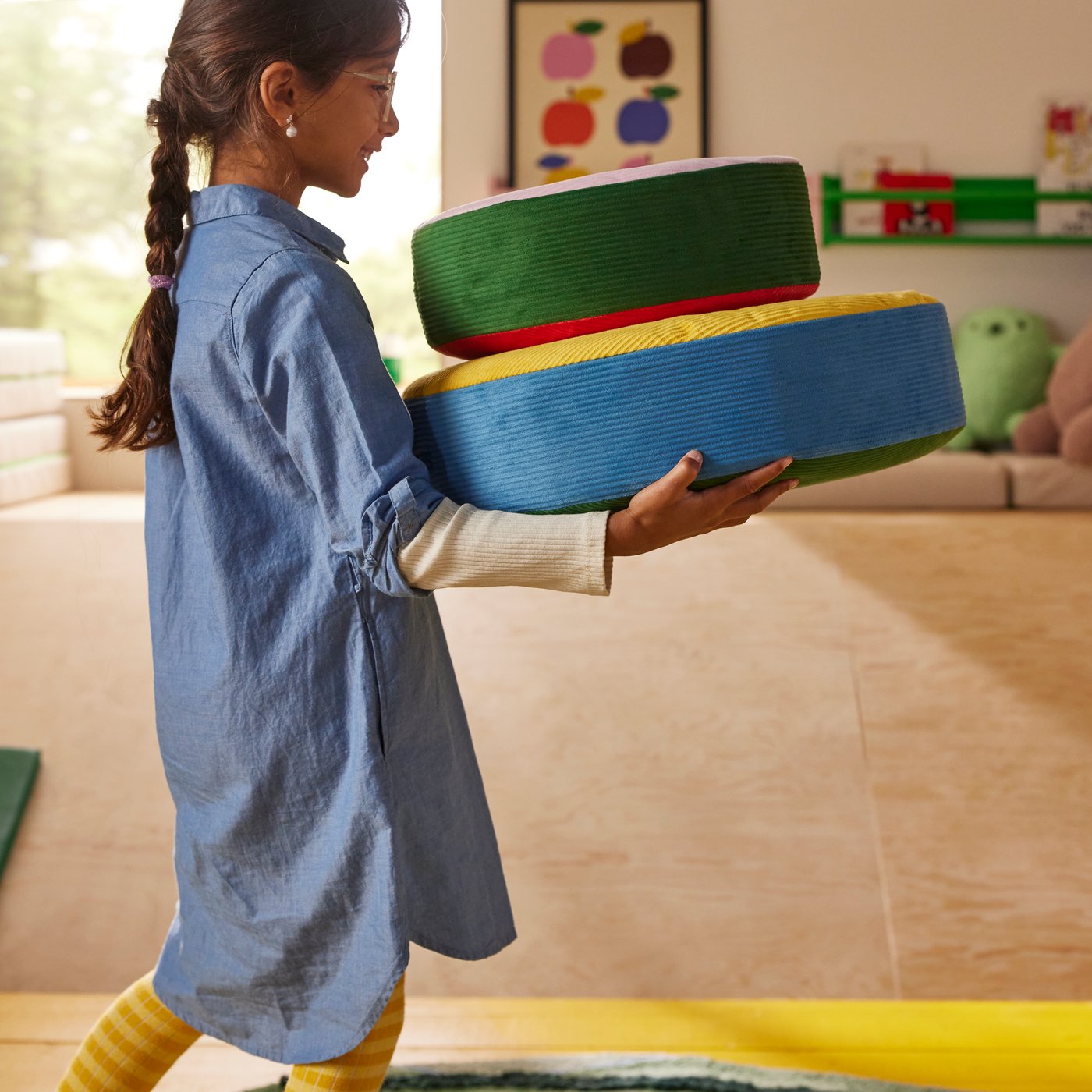 girl carrying cushions
