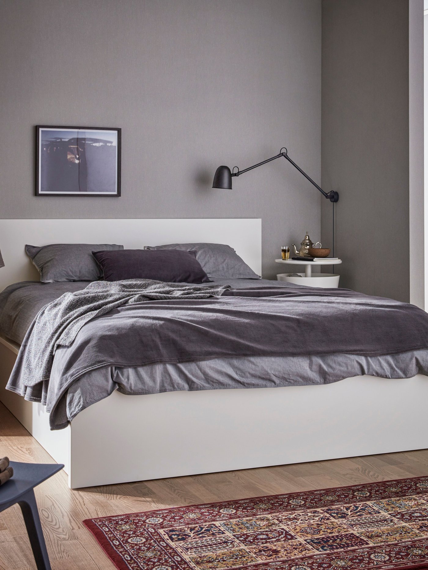 A white MALM ottoman bed