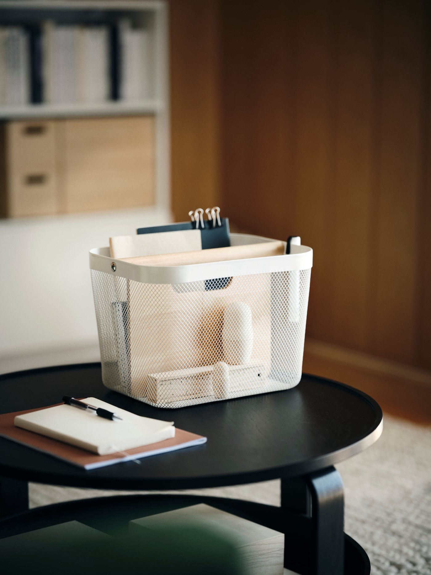 IKEA RISATORP white basket with compartments on a coffee table in the living room.