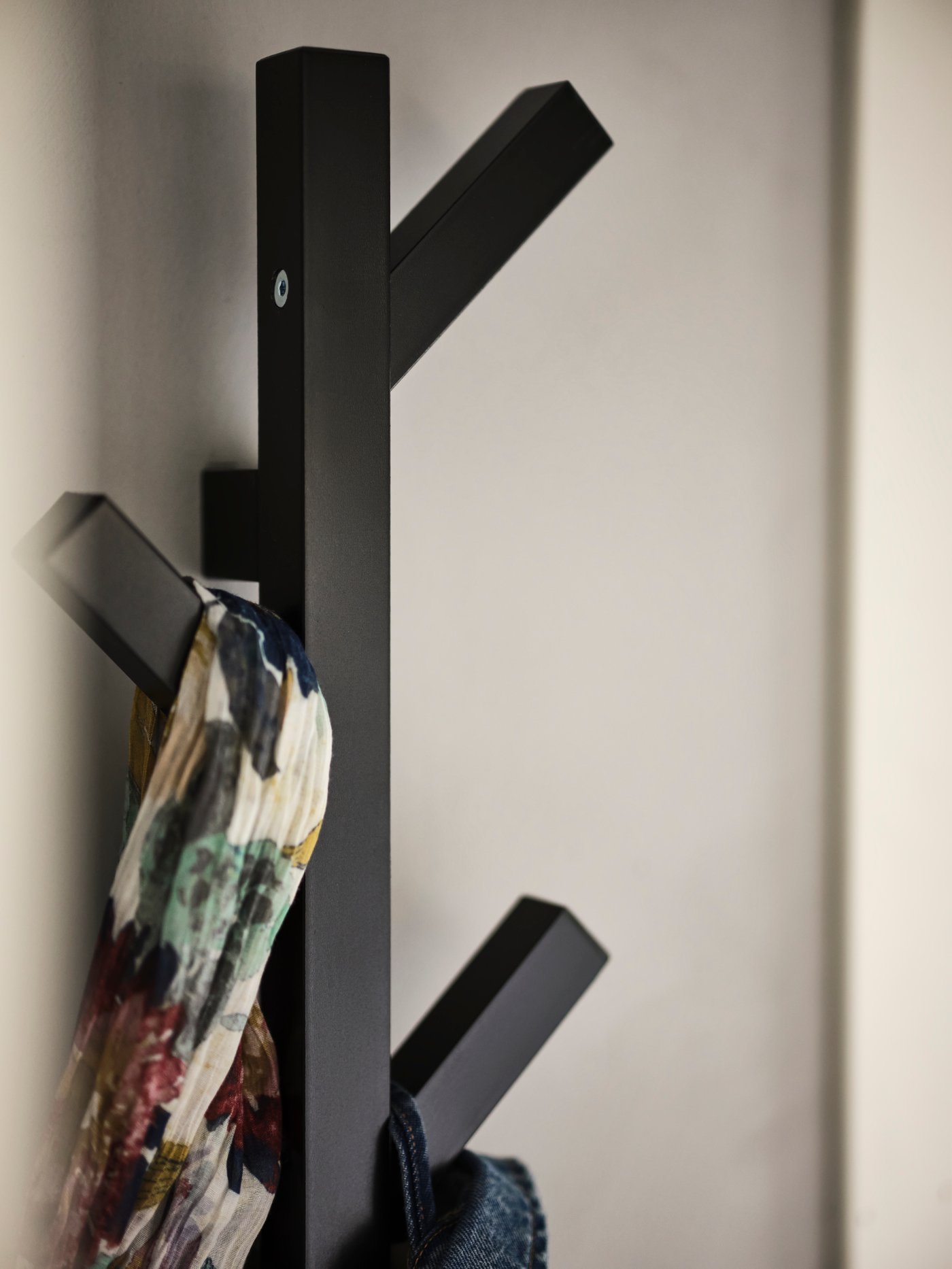 A black TJUSIG hanger in the bedroom.